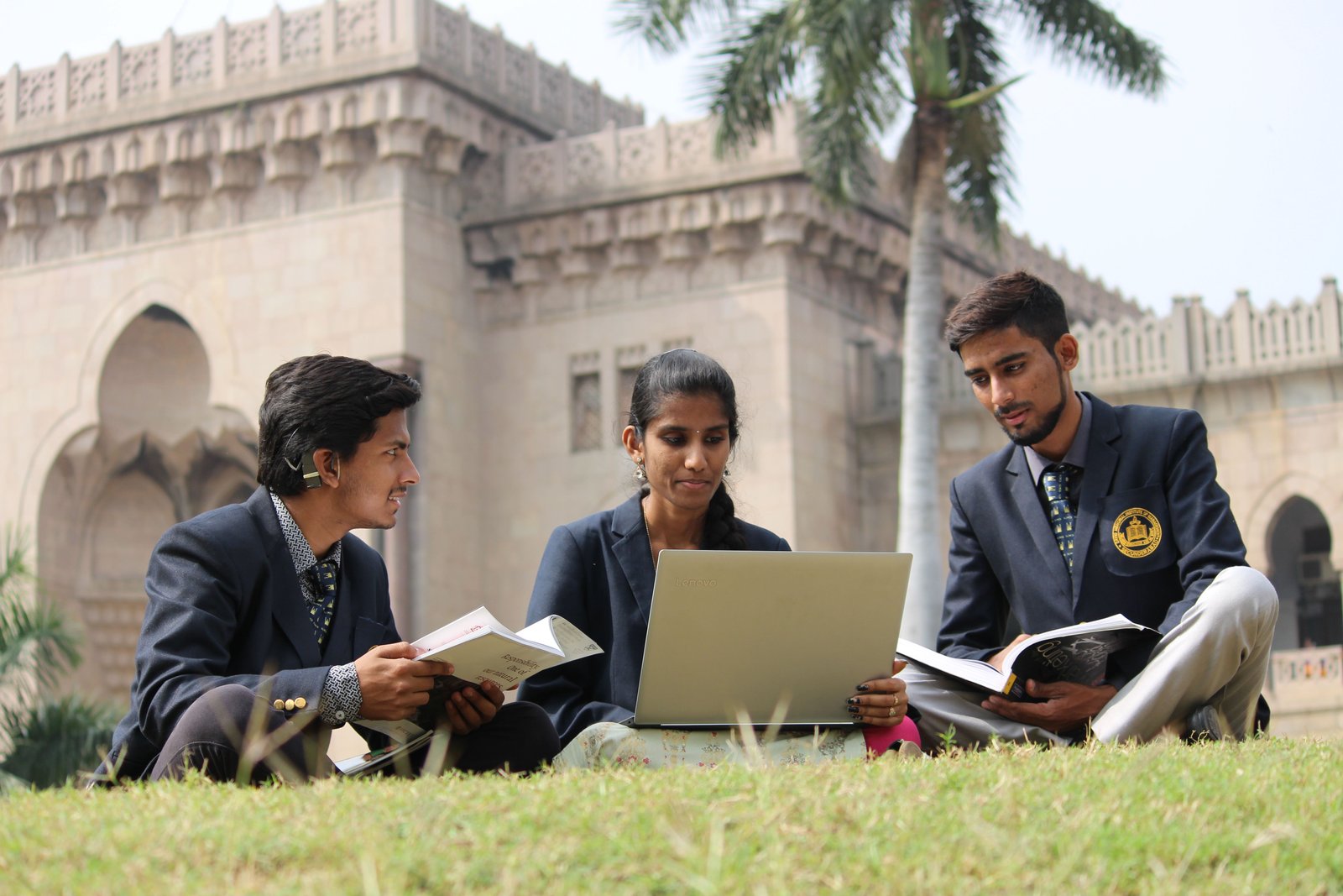 Indian students studying together outdoors